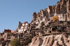 Annapurna 12 10 Braga Braga (3500m) is a Tibetan-style village of about 200 houses hiding behind a photogenic steep, eroded rock outcrop. The houses are stacked one atop the other, each with an open veranda formed by a neighbours rooftop. The gompa is perched on a high crag overlooking the village, and is estimated to be 400 to 500 years old. The gompa comprises three main buildings and belongs to the Kagyu sect of Tibetan Buddhism.